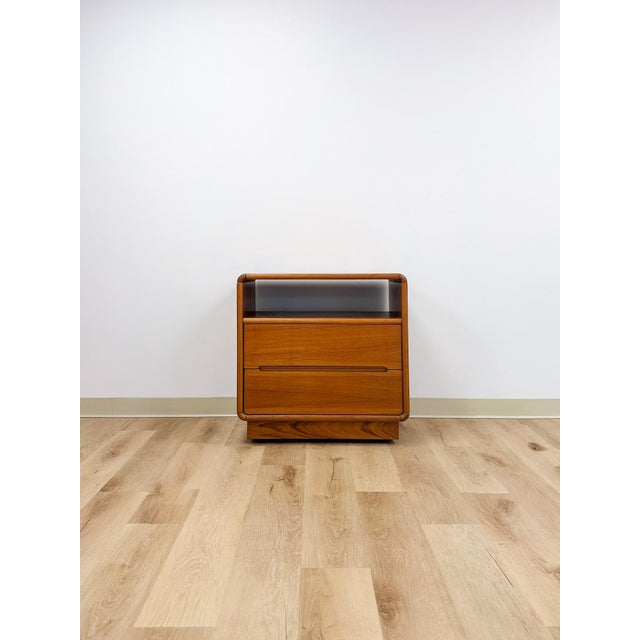 This practical and beautifully crafted vintage MCM teak rolling TV stand and cart is a versatile and good-looking Danish...