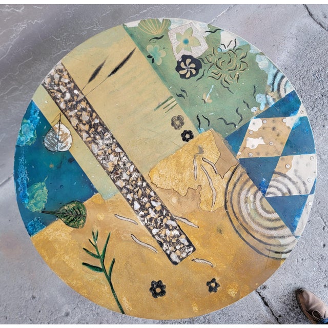 Unique round side or center table with painted black "spider" base and hand decorated abstract top surface. Top surface is...