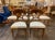 This set of 8 Biedermeier walnut dining chairs are made from high-quality walnut wood. These chairs feature a sleek and...
