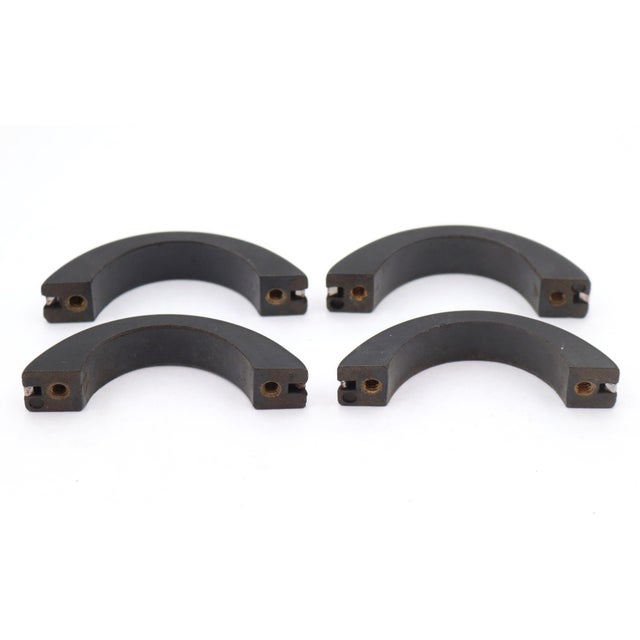 Vintage Art Deco style drawer or cabinet pulls made of black plastic with a chrome plated brass strip. Mounting screws are...