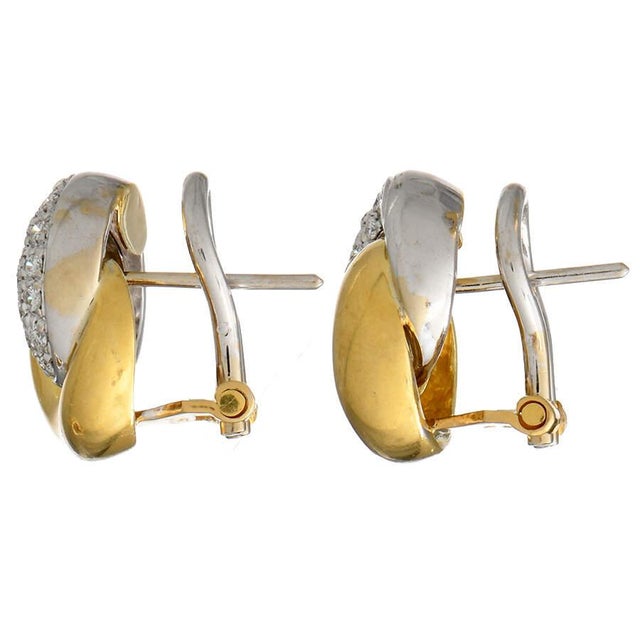 Ravishing yellow gold and diamonds interlock in an eternal embrace with these fabulously stylish diamond earrings. The...