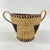 This vintage handmade basket, crafted by the Hausa people of Northern Nigeria, is an exquisite example of traditional...