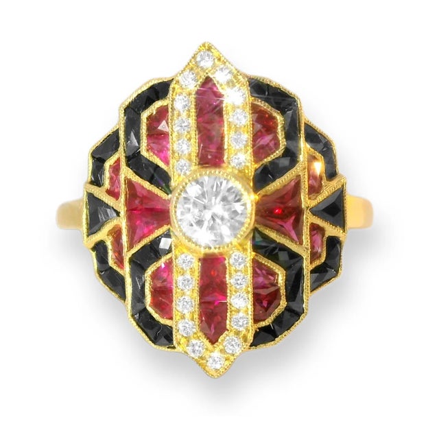 Bold Art Deco-inspired estate ring crafted in 18K yellow gold, featuring a 4mm brilliant round diamond centerpiece...