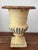This diminutive, pastel yellow, French garden urn with its egg and dart motif-a characteristic of the Medici style, is the...