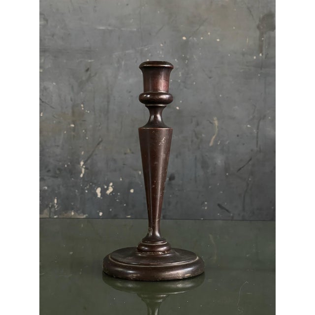 Nicely turned pair of early 20th century candlestick holders. Dark stained wood with good patina and age.