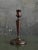 Nicely turned pair of early 20th century candlestick holders. Dark stained wood with good patina and age.