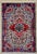 Vintage Hand-knotted village rug from the Nahavand area of western Iran, featuring a bold geometric medallion set within...