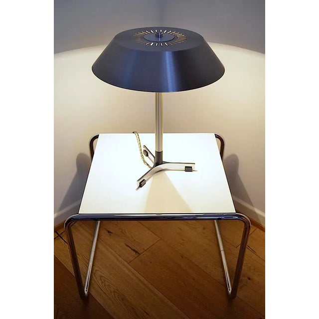 This Scandinavian mid-century desk lamp was designed by the designer Jo Hammerborg for the company Fog & Mørup. The lamp...