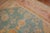 A colorful antique early 20th century Turkish Oushak rug. The field is teal; the border is pink. The rug has a lot of...