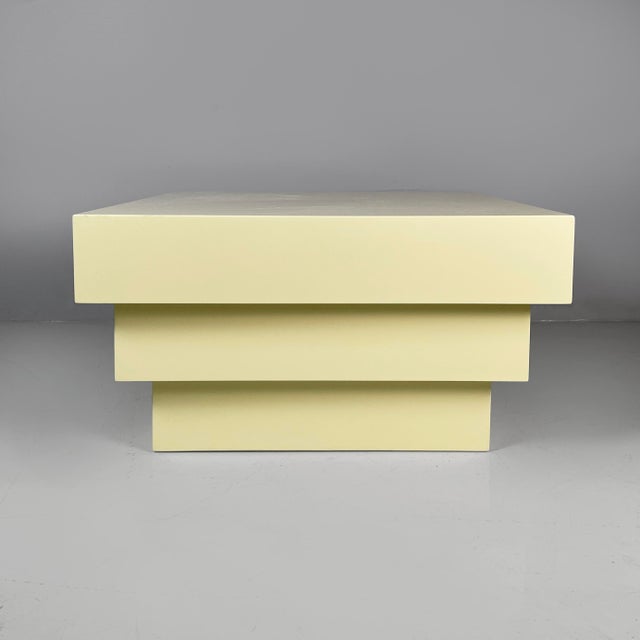 Italian modern coffe table or pedestal in light yellow wood, 1980s Pedestal or coffee table with a square top, made...