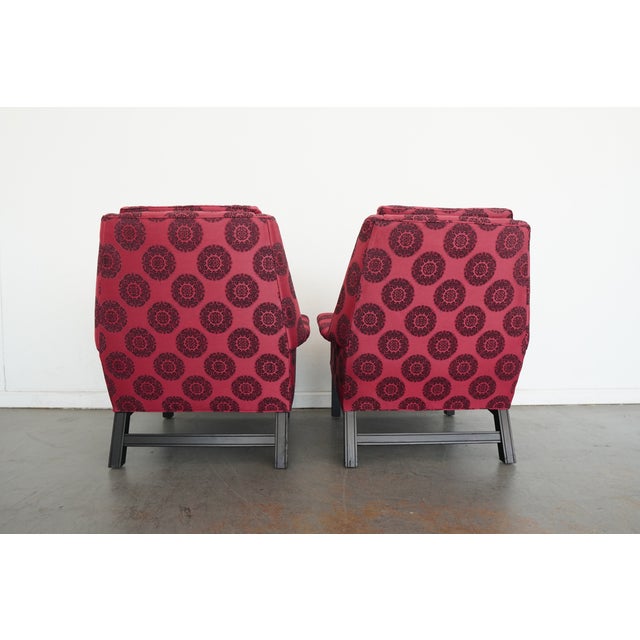 A striking pair of vintage club chairs by Harris of California, crafted in a dramatic silhouette that echoes the iconic...