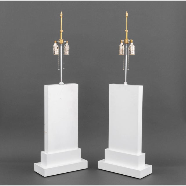 Pair of Minimalist White Painted Wood Table Lamps, each rectangular with stepped bases and two bulb fittings. Slightly...
