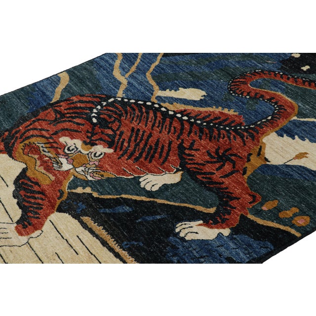 Hand-knotted in wool, this 4x7 modern tiger pictorial rug is a bold addition to the Rug & Kilim exclusive Tiger line. On...