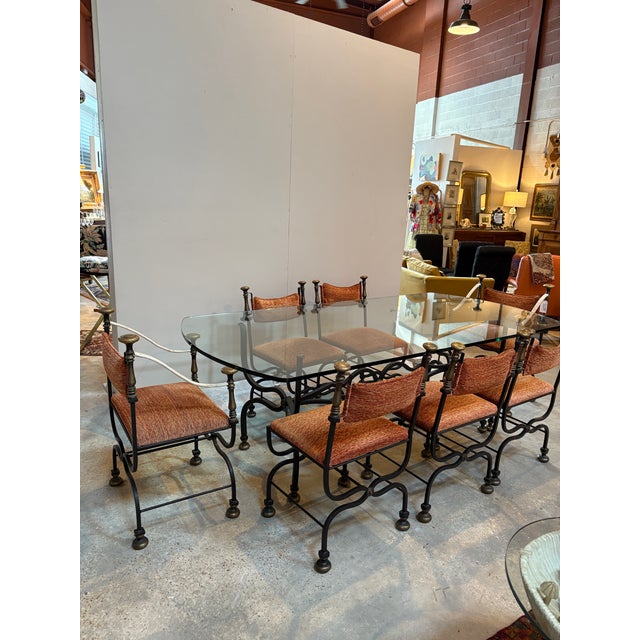Exceptional set of eight mid-century Italian Savonarola chairs and glass topped table with distinguished provenance. Also...