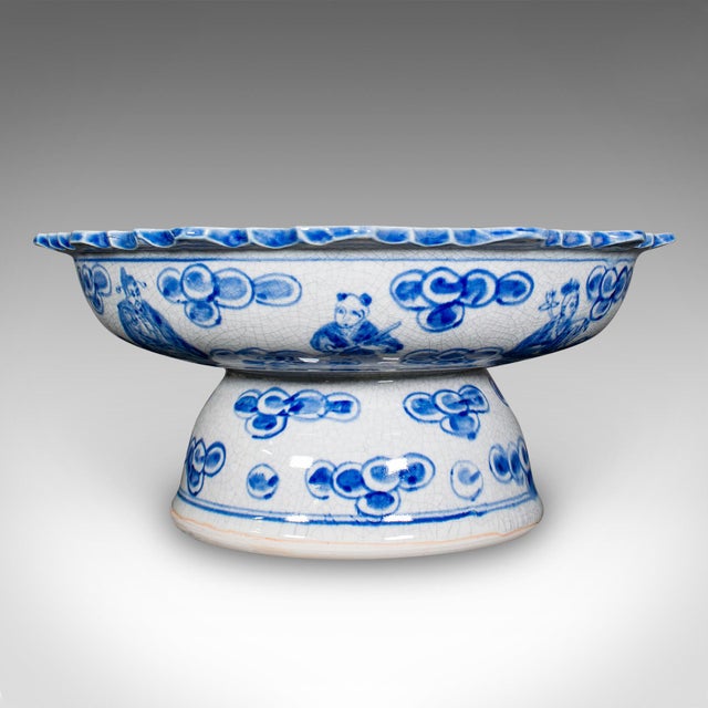 This is a vintage footed serving bowl. A Chinese, ceramic fruit or bonbon dish with Emperor motif, dating to the mid 20th...