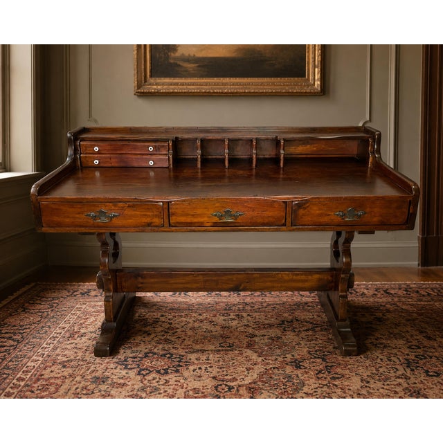 An attractive early 20th century Victorian writing desk crafted from solid pine, featuring an integrated upper hutch,...