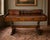 An attractive early 20th century Victorian writing desk crafted from solid pine, featuring an integrated upper hutch,...