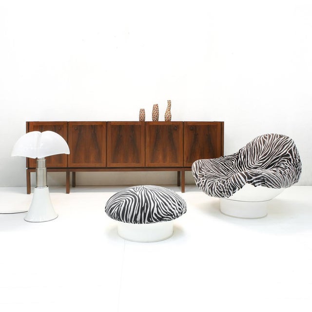 This eight-legged quality sideboard with beautiful bookmarked dark walnut veneer was made by Royal Board, Sweden in 1961....