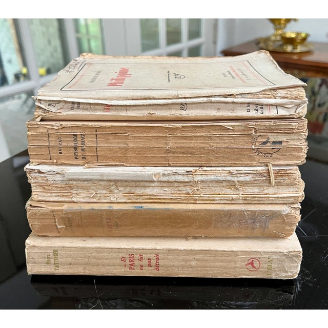 A collection of five unbound antique French library books dating from the early 1900s. Perfect for styling a bookshelf or...