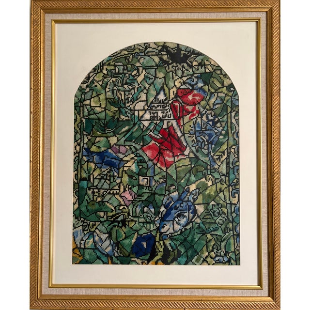 A vintage needlepoint profiled in a museum quality frame. Of a stained glass window by Marc Chagall. Marc Chagall debuted...