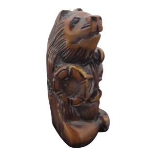 Antique Japanese Carved Wood Badger or Bear With Barrel Netsuke Figurine For Sale