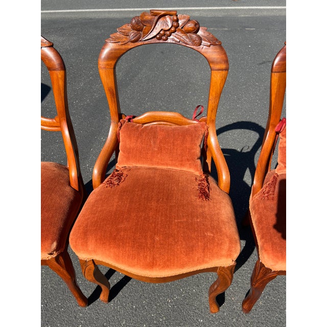 Presenting a set of Four Great Mahogany Victorian Side Chairs, adorned with red upholstered seats, an embodiment of...
