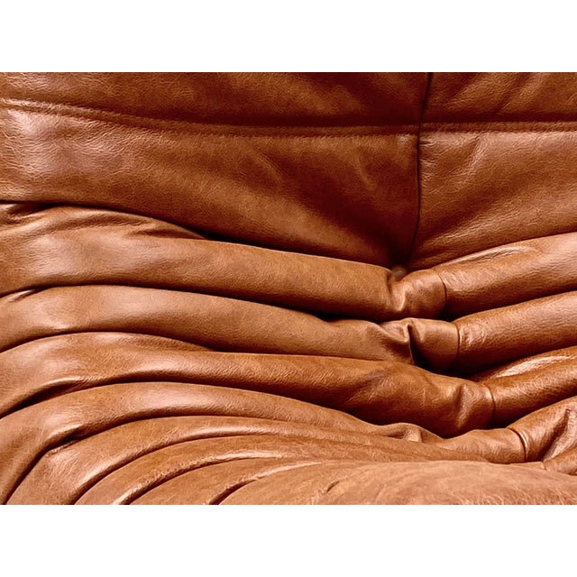 Togo Lounge Chairs in Cognac Cow Leather attributed to Michel Ducaroy for Ligne Roset, Set of 2, in Restored conditions....