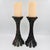 A pair of tall, heavy bronze-finish metal bamboo pillar candleholders. The design mimics clustered bamboo stalks flaring...