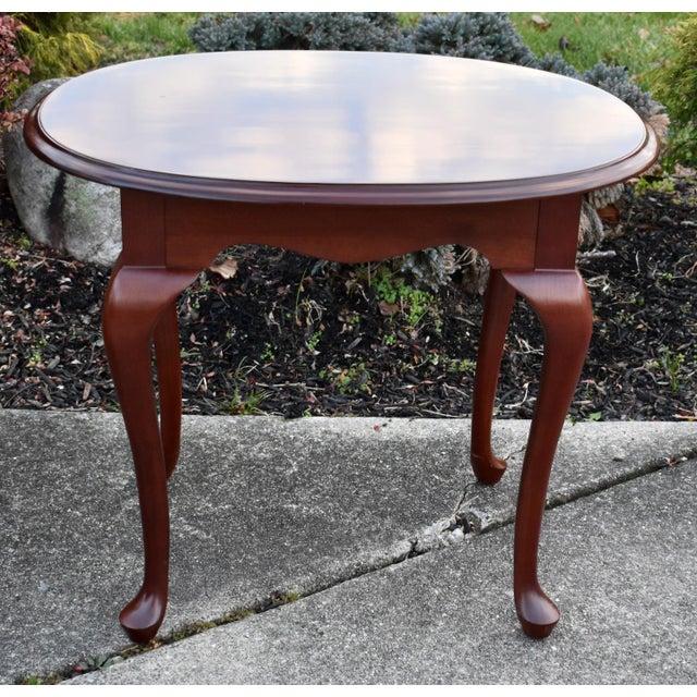 Vintage (1990's) Oval Side Table has a Queen Anne Style. Made by Ethan Allen. The Wood is CherryWood. The Measurements:...