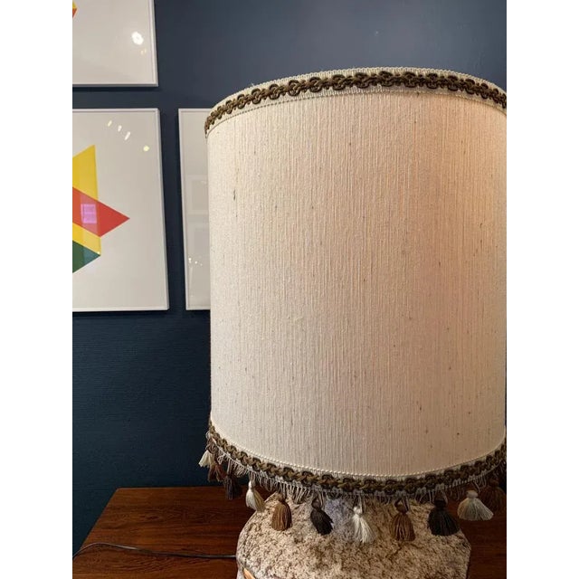 Well-preserved original. A total of 4 bulbs. Original shade that could also be easily replaced. This piece has an...