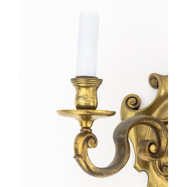 French Neoclassical Style Bronze Two-Branch Wall Sconce, with shield form back-plate and scroll arms. 10.5" H x 13.5" W x...