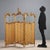 Rococo-style screen in carved and gilded wood. Three elements with a beveled glass top and a wooden panel covered in...