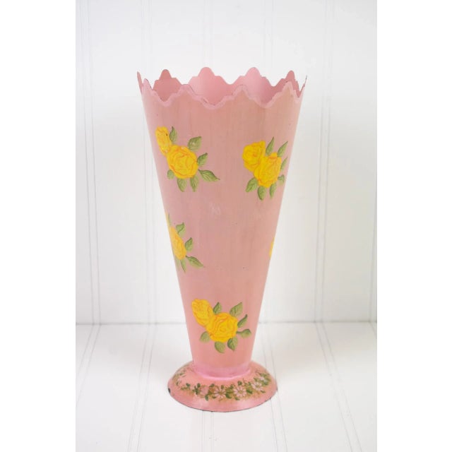 Vintage pink with hand-painted yellow flowers tin metal vase from the late 1950's - 1960's. Expect vintage wear including...