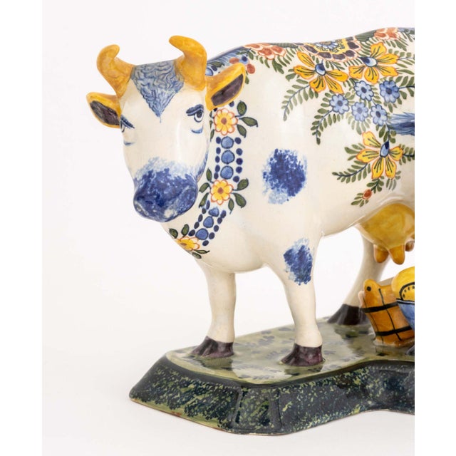 Pair of Dutch Delftware Cow and Milkmaid Figurines, hand-painted ceramic, blue "B/K / 8/3" marks to undersides. 7" H x...