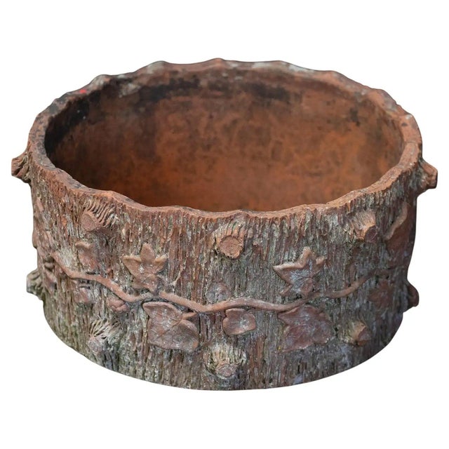 A fine English garden round planter pot of terracotta from the Edwardian era, featuring a faux bois or tree bark and vine...