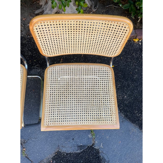 Classic mid century modern Cesca-style cantilever beech-wood chairs with chrome tubular frames and woven cane seats/backs....