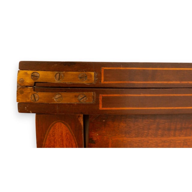 Restored antique mahogany demilune folding game table, c. late 19th to early 20th century. This game table beautifully...
