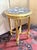 A round, giltwood pedestal table in the Louis XVI style, circa 1880. Made of carved wood with a veined white marble top....