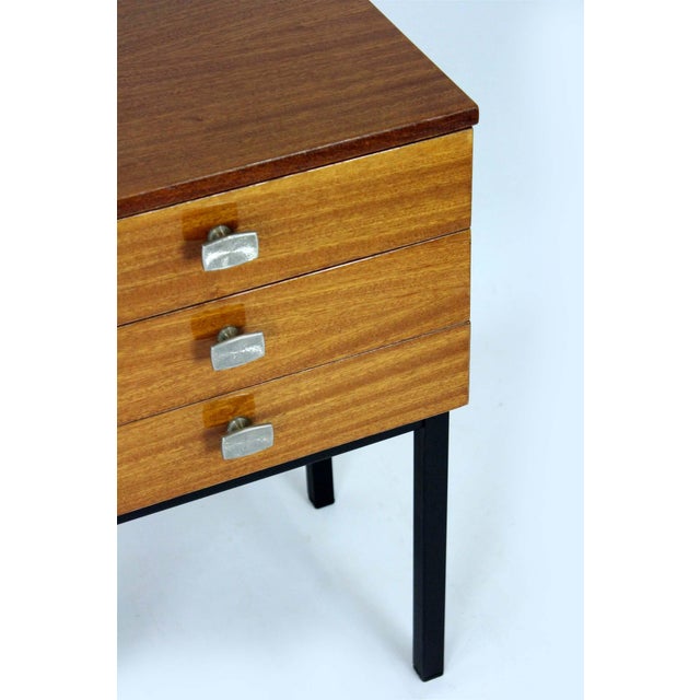 These Mid-Century Modern bedside tables were manufactured in Czechoslovakia in the 1970s. The cabinets are veneered in...