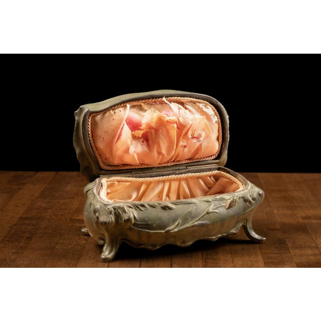 Vintage art nouveau jewelry casket. 3.5"W x 4"H. This vintage jewelry casket is possibly constructed from brass as it...