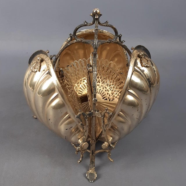 We offer a piece of exceptional rarity and collectible value: a magnificent victorian folding biscuit box, made by the...