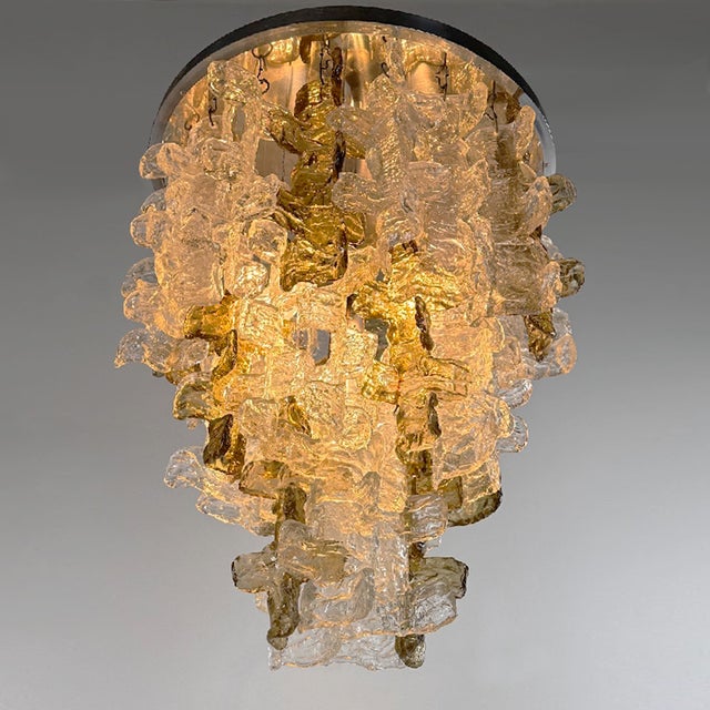 1960s chandelier with metal frame and glass elements. Complete in all its parts. Good condition. The chains holding the...
