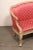 An Italian beautifully carved wood and upholstered sofa from the early 19th century. This antique tub style sofa from...