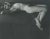 A Vintage black and white photograph of a reclining male nude by Judy Dater (1941-) untitled.