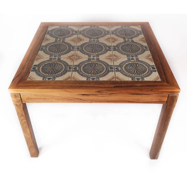 Coffee table in rosewood and with tiles of Danish design from the 1960s. The table is in great vintage condition.
