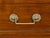 A pair of French Neoclassical style walnut commodes from the 19th century, with white marble tops, three drawers, fluted...