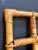 "A vintage Italian square bamboo wall mirror from the 1980s, featuring a natural and rustic design that brings warmth and...