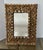 Spanish Colonial style wall mirror in dark giltwood and gesso finish, with inlaid mosaic mirror accents. Center mirror has...