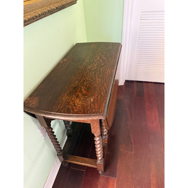 Antique Solid Tiger Oak English Drop Leaf Barley Twist Table featuring classic Baroque motif. Handsome entry or display...
