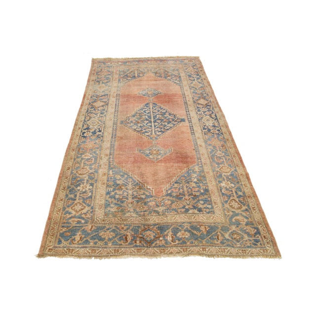 This exceptional Bidjar wool rug, boasting an antique charm, showcases exquisite hand-knotted wool with a red rust color...